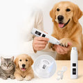 Electric pet nail grinder being used on a dog's nail with a cat and puppy nearby, showcasing ease of use for pet grooming.